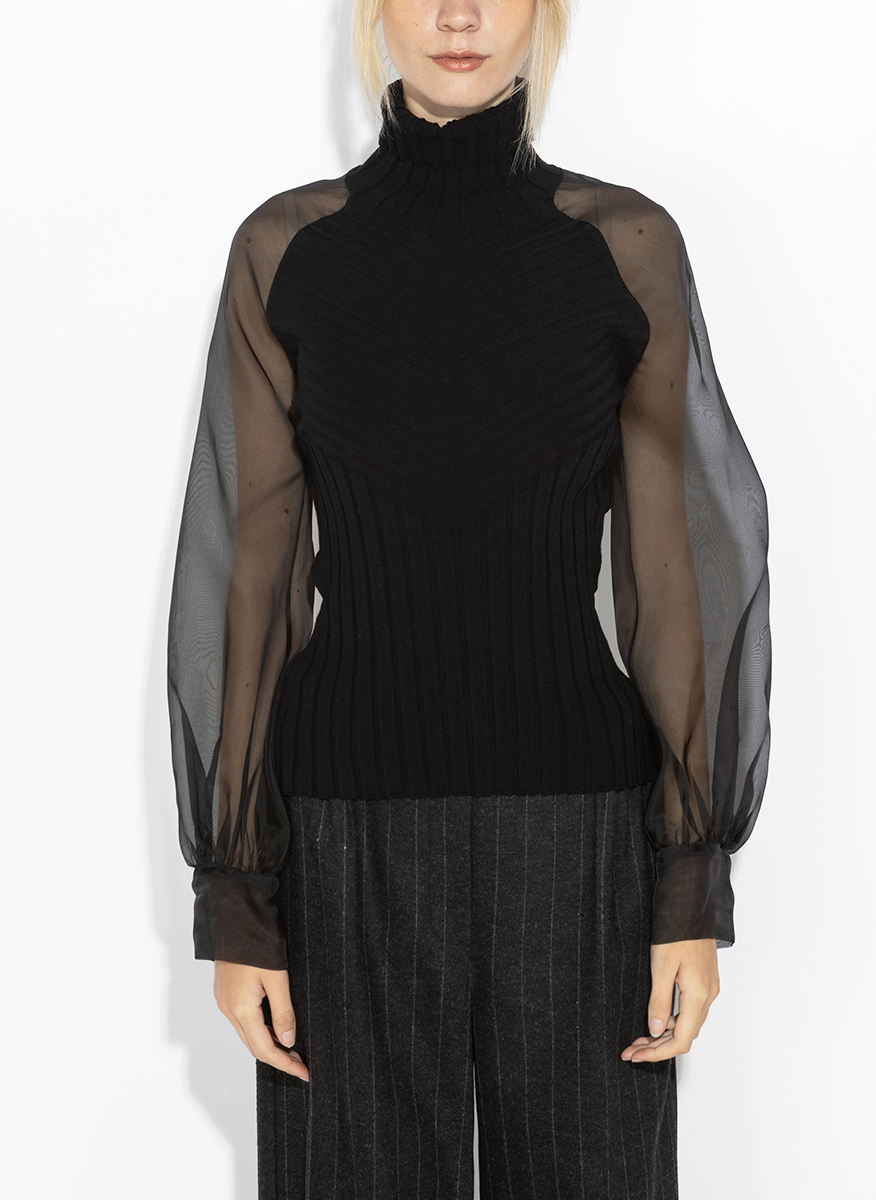 D.Exterior sheer-effect blouse
