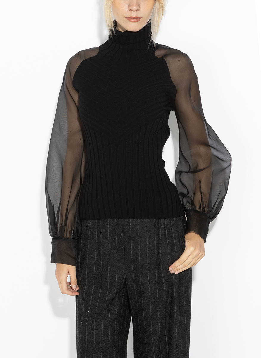 D.Exterior sheer-effect blouse