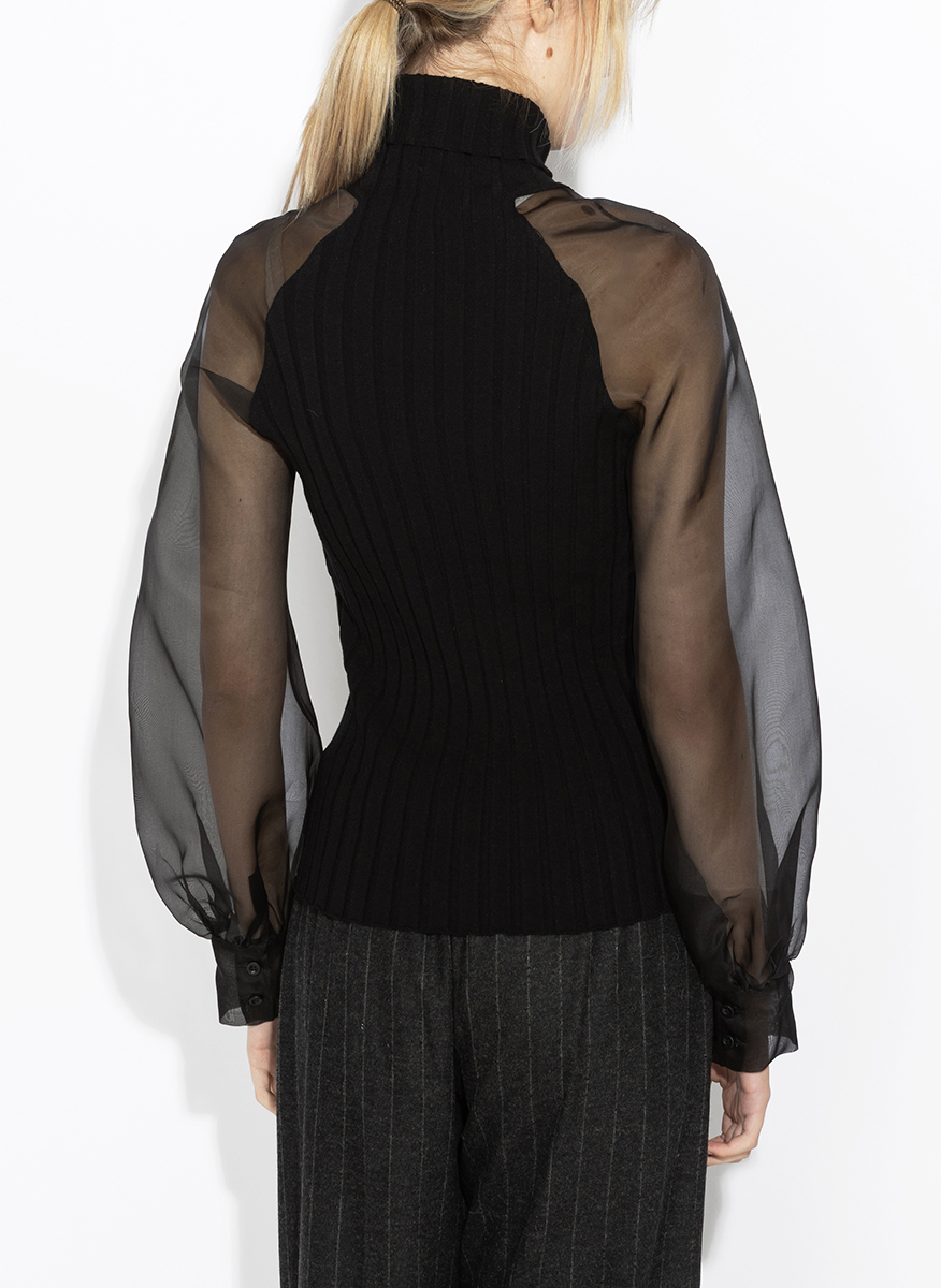 D.Exterior sheer-effect blouse